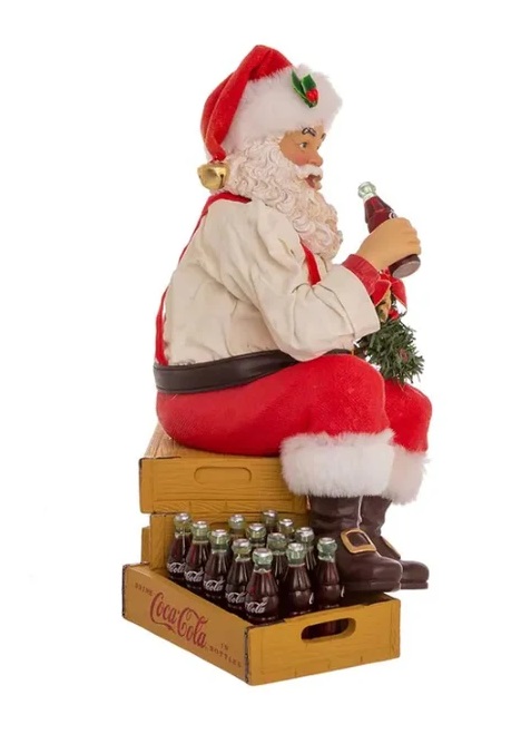 Babbo Natale seduto sulle casse di Coca Cola in resina e tessuto - H.23 cm - KurtAdler
