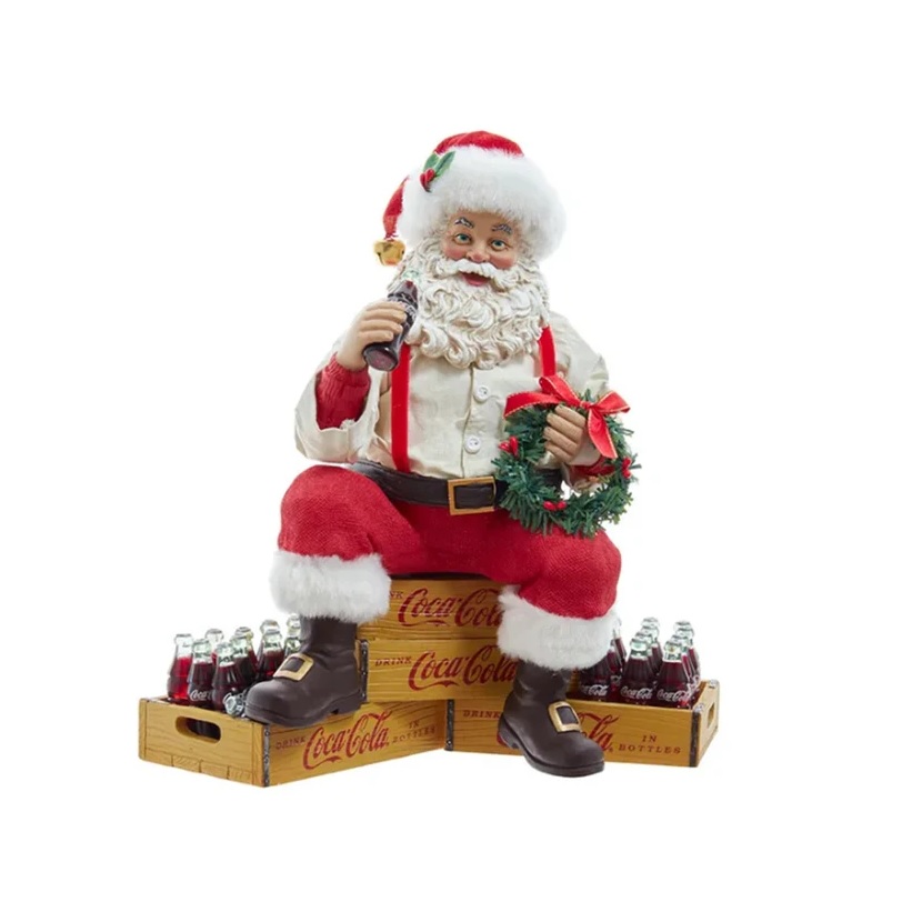 Babbo Natale seduto sulle casse di Coca Cola in resina e tessuto - H.23 cm - KurtAdler